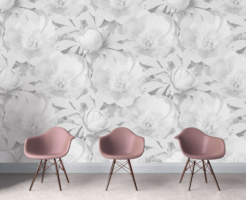Peony Supersized wallpaper with large delicate floral pattern and subtle shading in neutral tones behind modern pink chairs