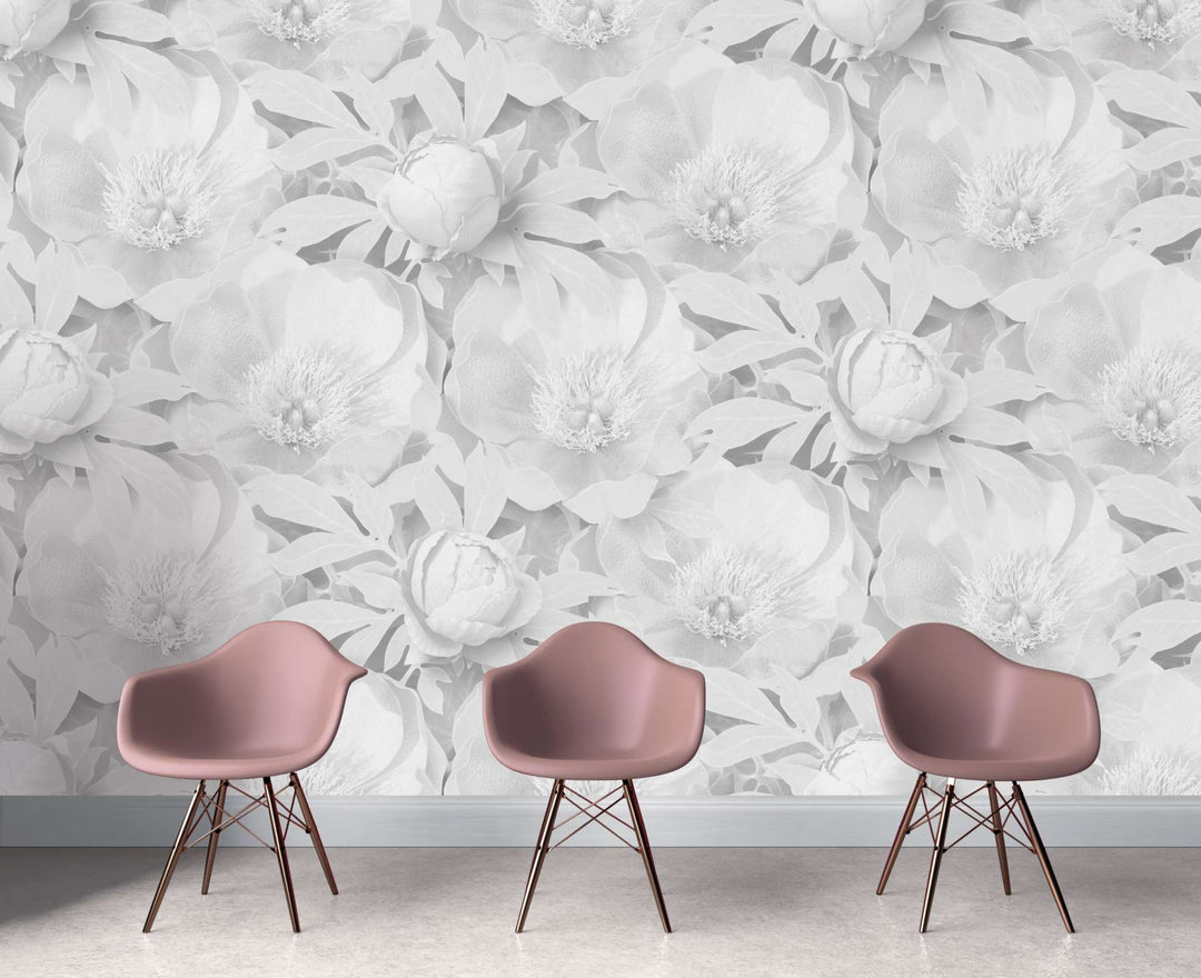 Peony Supersized wallpaper with large delicate floral pattern and subtle shading in neutral tones behind modern pink chairs