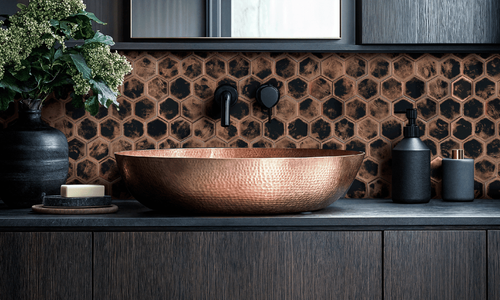 dark moon hex geometric copper tile wallcovering behind copper sink in modern bathroom
