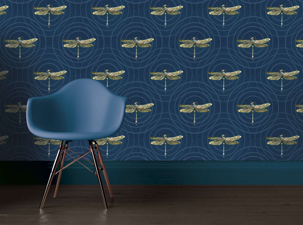 Dragonfly wallpaper Insects Noir Anisoptera Botanicus in petrol blue with detailed insect pattern behind a modern blue chair