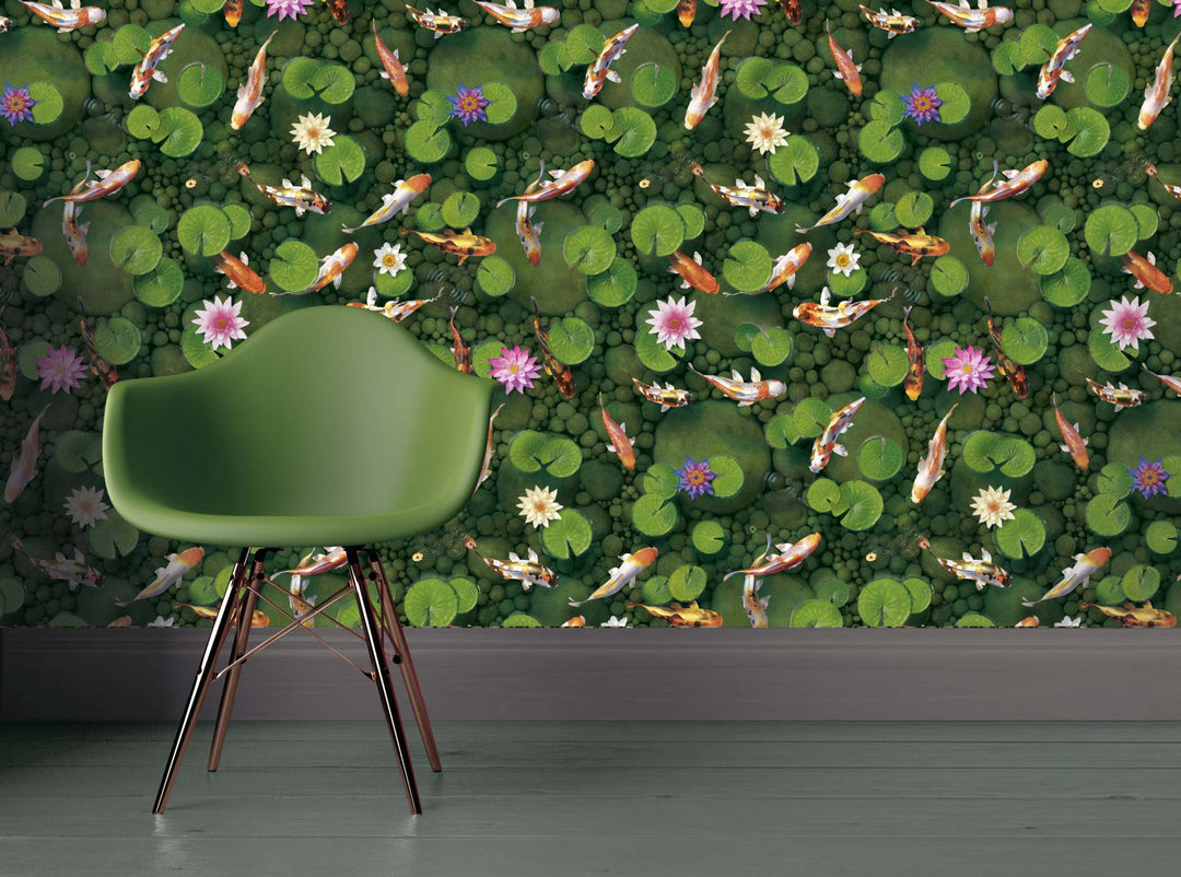 Koi carp fish wallpaper with green lily pads and pink flowers behind a green chair
