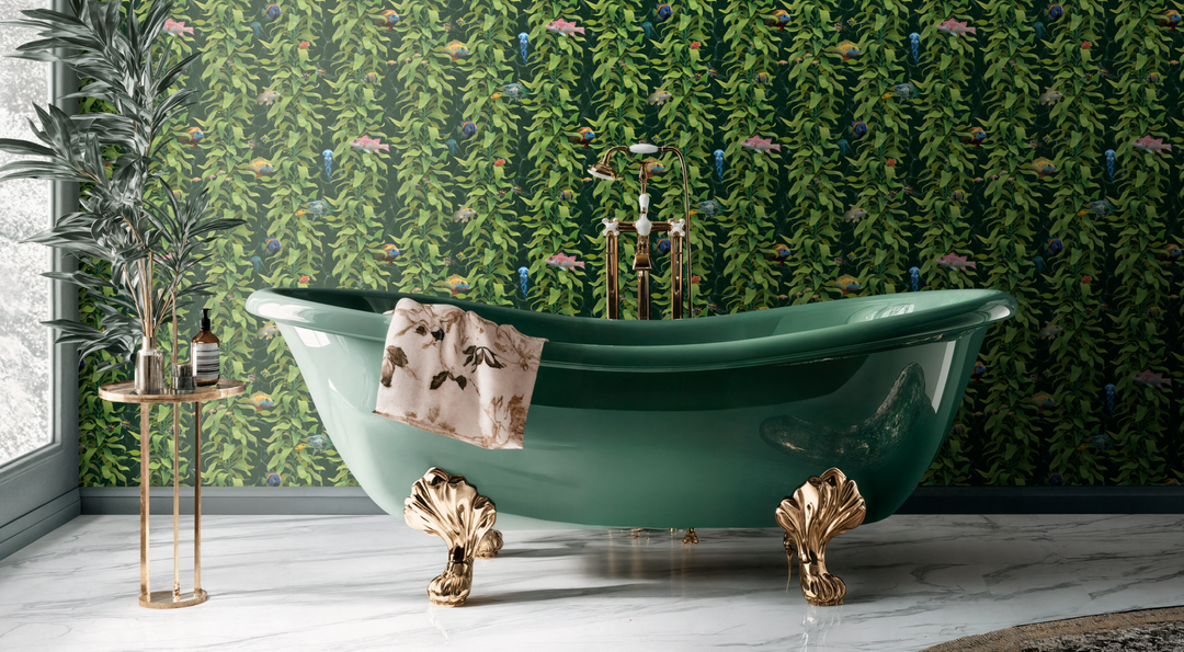 Luxury ocean fish wallpaper with detailed sea kelp and fish design in ocean green, shown in elegant bathroom behind green clawfoot bathtub with gold accents.