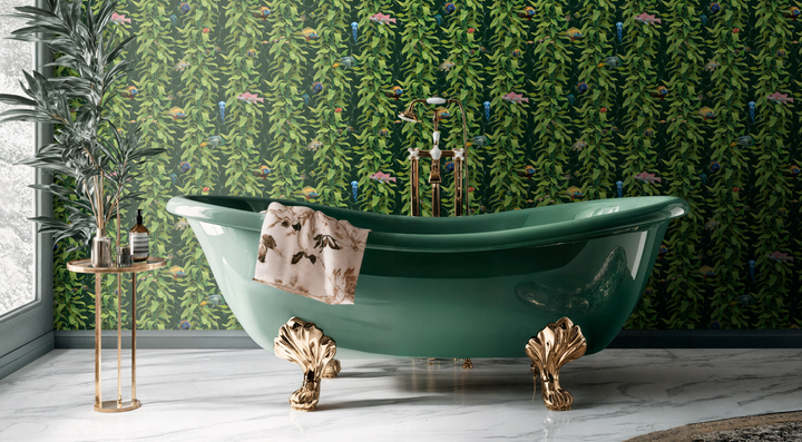 Luxury ocean fish wallpaper with detailed sea kelp and fish design in ocean green, shown in elegant bathroom behind green clawfoot bathtub with gold accents.